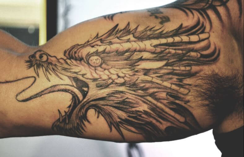 Inner Bicep Dragon Tattoos