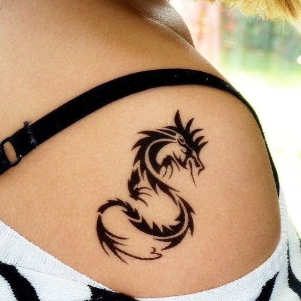 Tribal dragon tattoo back