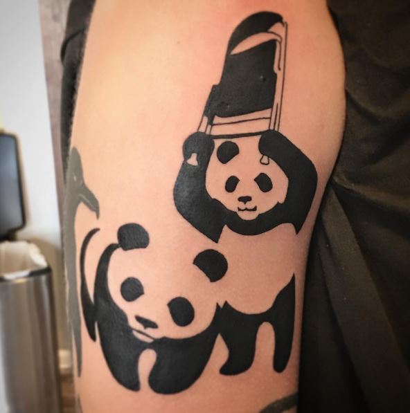 Panda bears tattooed on the wrist