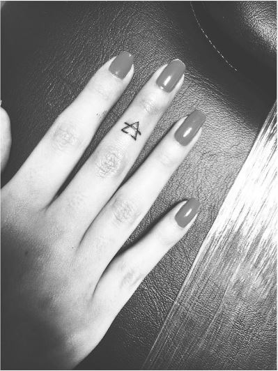 Small Glyph Tattoos Design On Middle Fingers