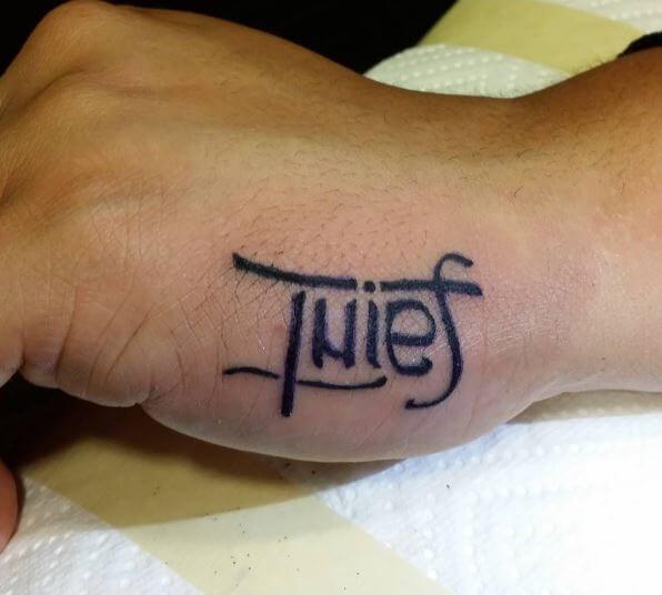 Thief Ambigram Tattoos On Hands