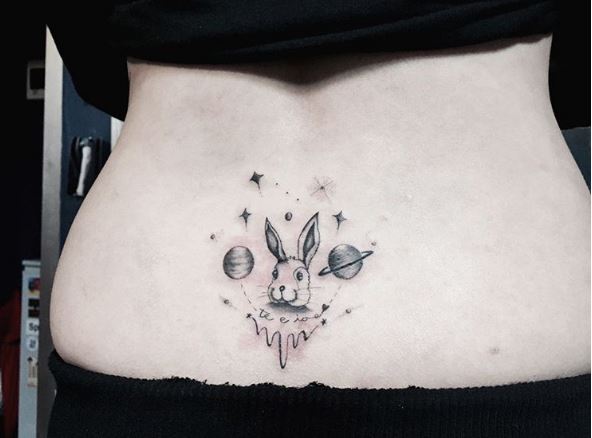 Twin Universe Planet Rabbit Tattoo Design On Backside