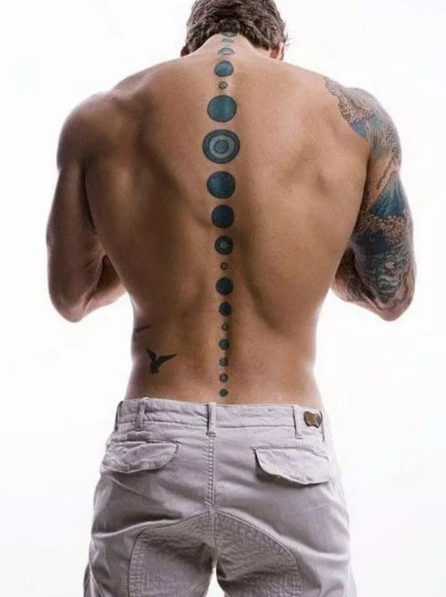 Bottom Of Spine Tattoos