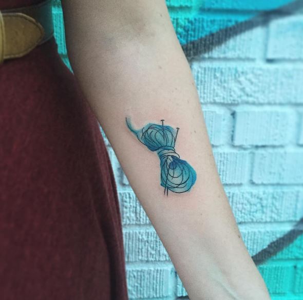 Small Blue Color Knitting Tattoos Design On Forearm