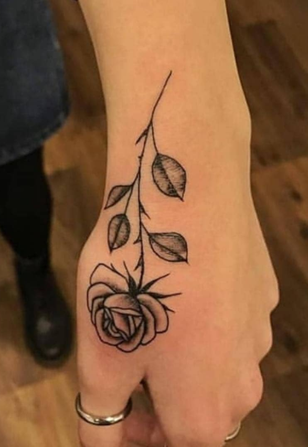 black rose tattoo hand