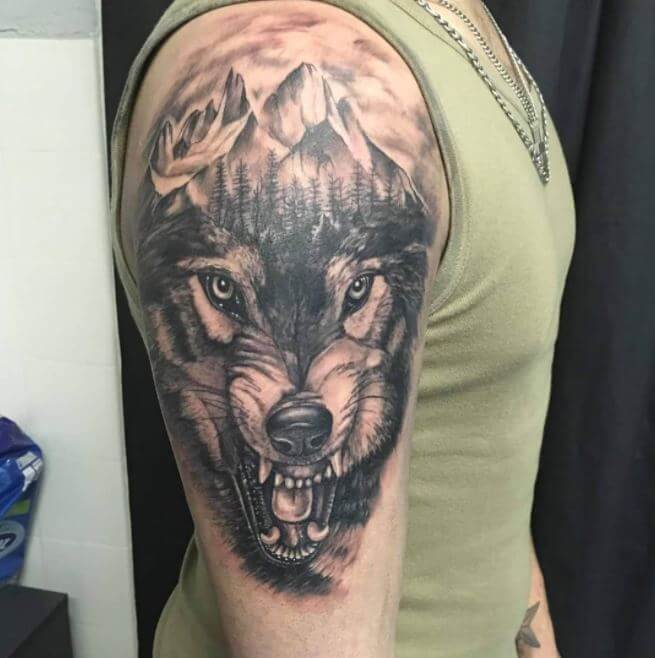 Sketchy wolf tattoo on the left shoulder and chest