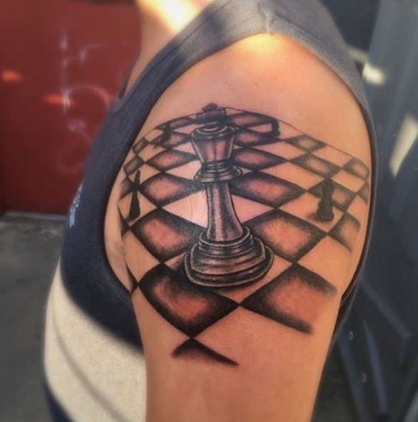 Chess Board And King Tattoos Design On Biceps