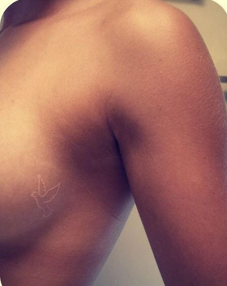 White Dove On Side Breast Tattoo