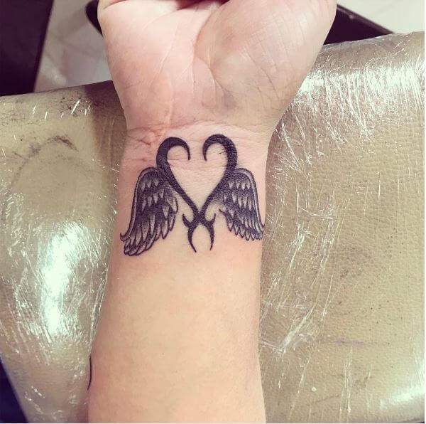 22. Wrist is ideal place for small size angel wing tattoos. 