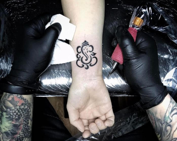 Tiny Ganesha Tattoos