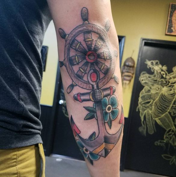 Wheel And Anchor Elbow Tattoos