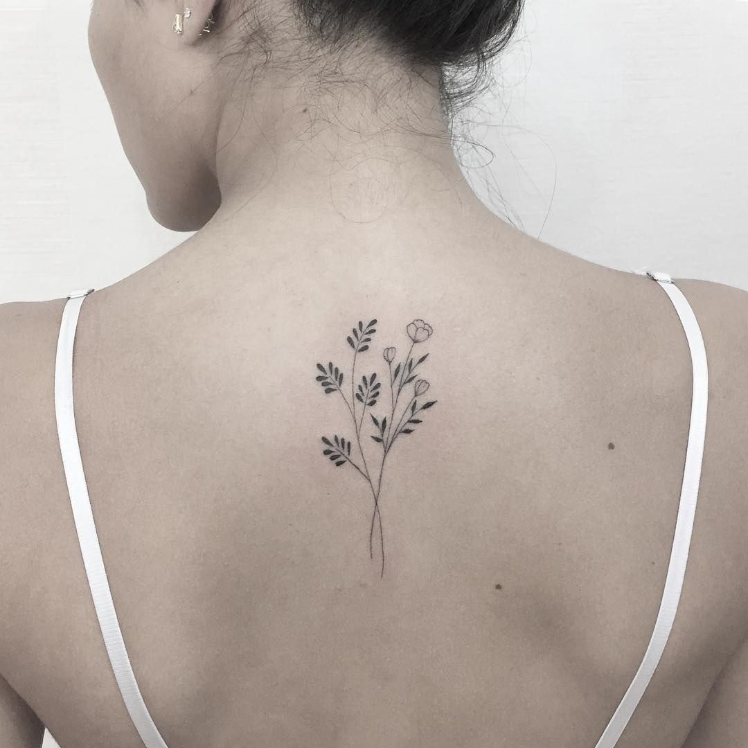 Learn 97+ about back flower tattoo small unmissable .vn