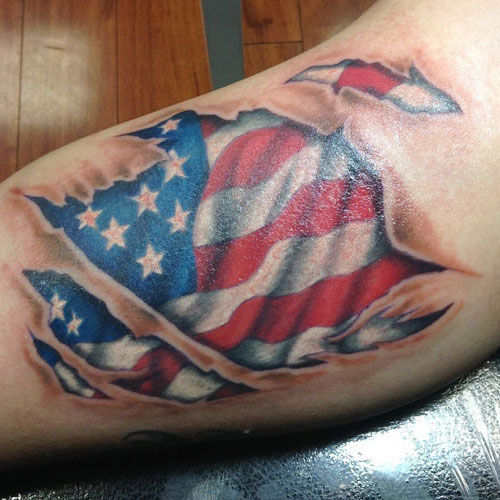 Awesome Ripped Skin American Flag Bicep Tattoo