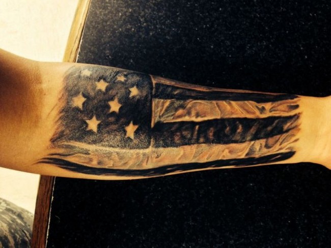 Black Realistic US Flag Tattoo On Forearm