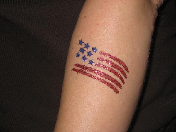Small Glittering US Flag Tattoo On Arm Sleeve