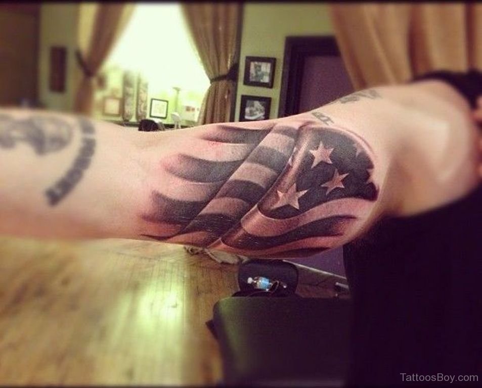 Wonderful Flying US Flag Tattoo On Biceps