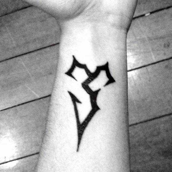 Small Simple Final Fantasy Symbol Wrist Tattoo With Black Ink Design