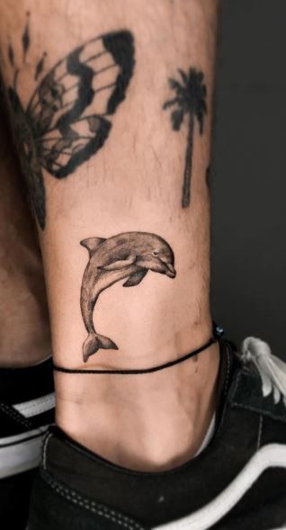 180+ Creative Dolphin Tattoos Designs with Meanings (2023) - TattoosBoyGirl