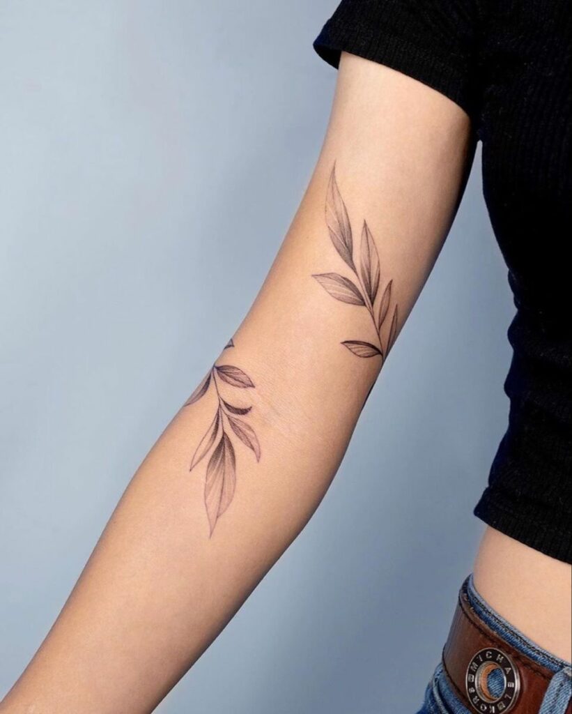 rose vine tattoos on arm